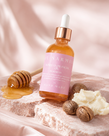 Sol Narmina Honey Glow Facial Oil with honey and shea butter on soft pink background